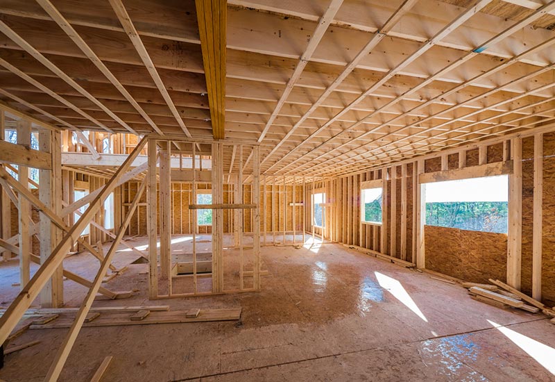 Interior view of a house under construction home framing